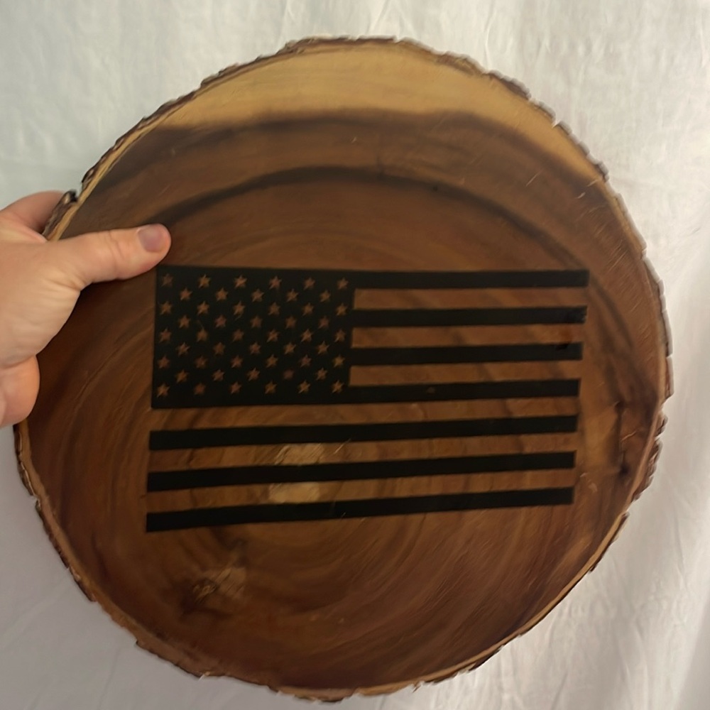 Circle wooden tray trivet with raw edge and black american flag